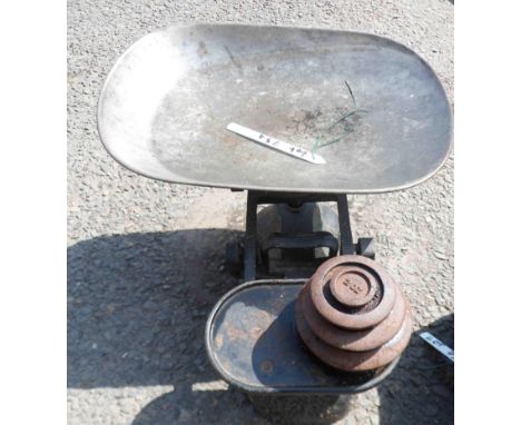 An old set of scales with four weights