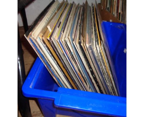 A crate containing a quantity of LP records including Michael Jackson, Dire Straits, Neneh Cherry, etc.