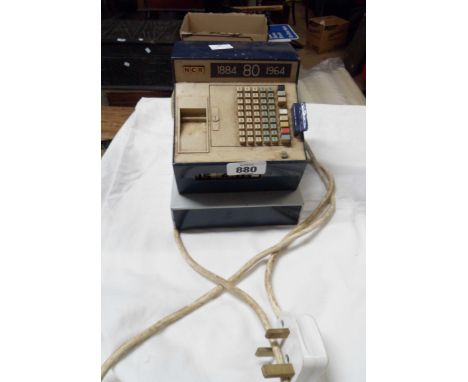 A digital desk clock in the form of a vintage NCR cash register in the blue colourway