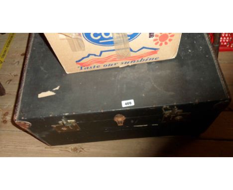 An old travelling trunk with tray fitted interior and leather bound canvas weather coating
