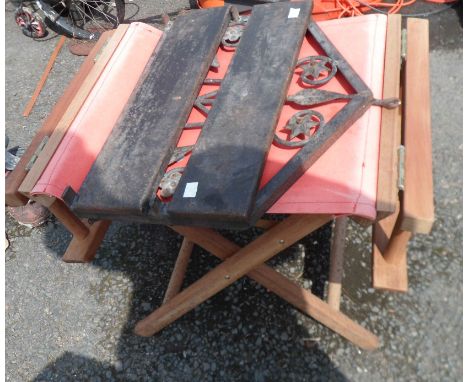 A folding director's chair - sold with a wrought iron folding shelf