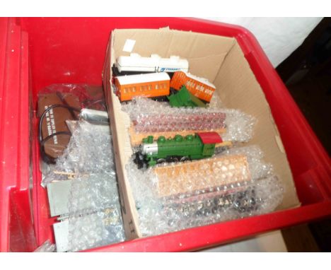 A crate containing a late Bachmann 'Smokey Mountain Express' locomotive and tender, various carriages, track and power contro