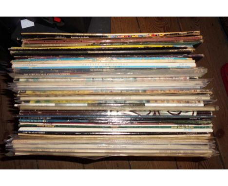 A crate containing a quantity of LP records including Level 42, Michael Jackson, 10cc, ABBA, etc.