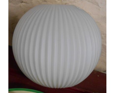 A white opaque glass hanging ceiling shade of ribbed globe form