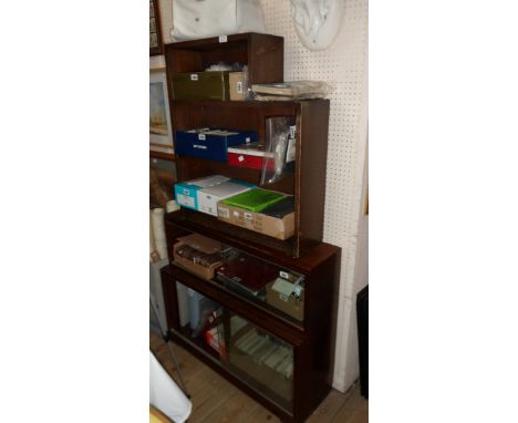 An 89cm retro polished mixed wood Minty two section modular bookcase enclosed by glass sliding doors - sold with a 68.5cm ste