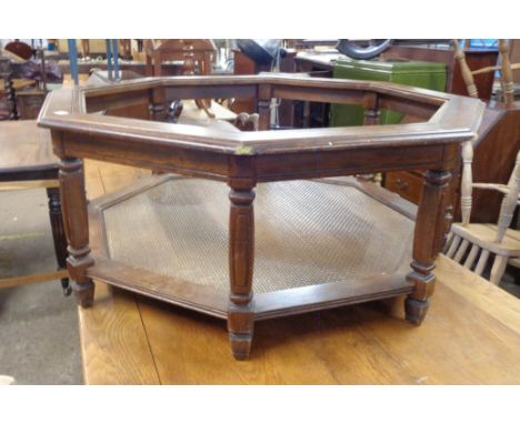 An 80cm modern stained wood framed two-tier octagonal centre table with glass inset top and rattan effect undertier