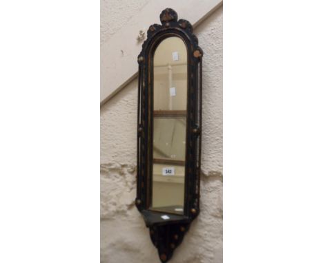 A Victorian ebonised and parcel gilt framed niche mirror with bracketed shelf under