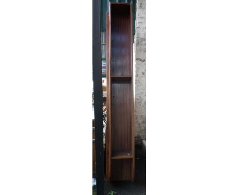 A large mahogany wall mounted book shelf