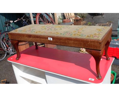 A tapestry topped dressing stool, set on cabriole legs