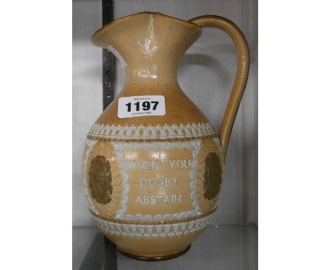A Doulton Lambeth salt glazed stoneware jug with applied mottos and portrait roundels