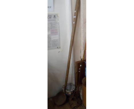 A large ladle with long wooden handle