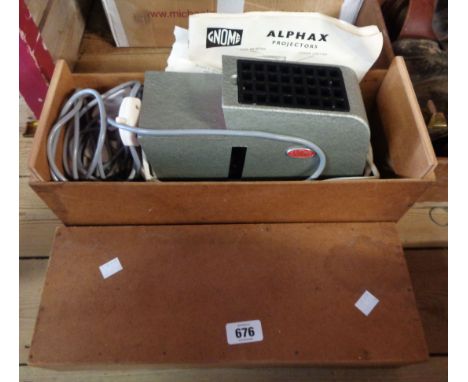 A vintage Gnome slide projector in original wooden box