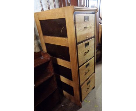 A 49cm vintage oak four drawer filing cabinet with varnished inset side panel and original drawer furniture