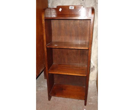 A small mahogany four shelf open bookcase