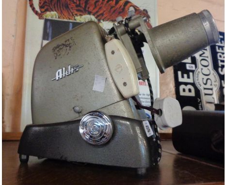 A vintage Aldis slide projector - sold with a Kopil III A8 Electric Eye Zoom-ee cine camera