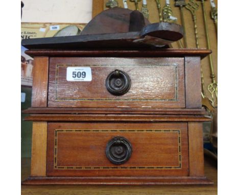 A small four drawer collector's specimen cabinet containing a small quantity of collectable items including E &amp; NH Cotter