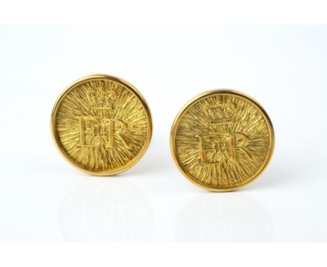 OF ROYAL INTEREST: A PAIR OF 9CT GOLD CUFFLINKS BY GERALD BENNEY, each circular panel with Elizabeth II cypher to a bark text