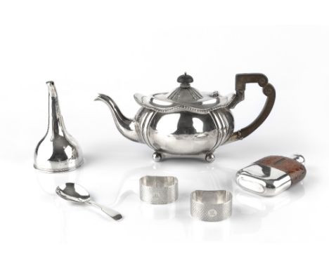 AN EDWARDIAN SILVER BACHELOR'S TEAPOT, with ebonised handle and knop, Sheffield 1902; a silver mounted hip flask, Sheffield 1