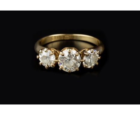 A DIAMOND THREE STONE RING, the graduated round brilliant-cut diamonds in claw setting, 18ct gold mounted, total diamond weig