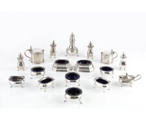 A PAIR OF SILVER TRENCHER SALTS, with blue glass liners by Garrard &amp; Co Ltd, London 1927, 8cm long; seven further silver 