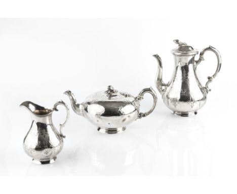 A MID VICTORIAN SILVER THREE PIECE TEA AND COFFEE SERVICE, comprising teapot, coffee pot and milk jug, with engraved decorati