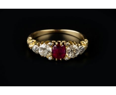 A RUBY AND DIAMOND HALF HOOP RING, the oval mixed-cut ruby claw set between pairs of graduated round brilliant and old-cut di