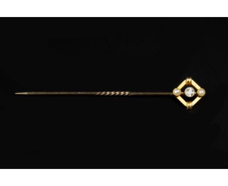 A DIAMOND AND HALF PEARL SET STICK PIN, the openwork lozenge-shaped panel centred with an old-cut diamond between two half pe