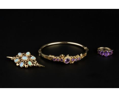 A SMALL COLLECTION OF GEM SET JEWELLERY, comprising an opal cluster brooch, 9ct gold mounted, an amethyst set bangle, of hing