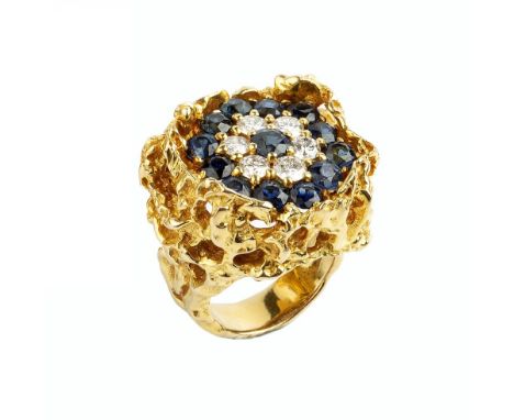 A SAPPHIRE AND DIAMOND CLUSTER RING, of pierced and textured abstract design, centred with a target cluster of circular mixed