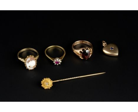 A SMALL COLLECTION OF JEWELLERY, comprising a ruby and diamond cluster ring, 18ct gold mounted, a garnet single stone ring, 9