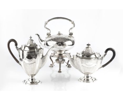 A MID VICTORIAN SILVER PLATED TEA KETTLE ON STAND, of compressed circular form, with foliate engraved decoration and swing ha