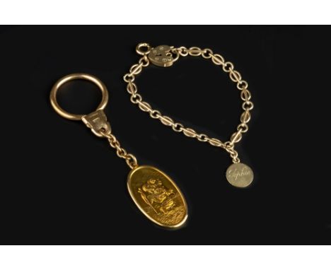 A 9CT GOLD ST CHRISTOPHER KEY FOB, inscribed, and a 9ct gold fancy-link bracelet, with inscribed circular pendant and padlock