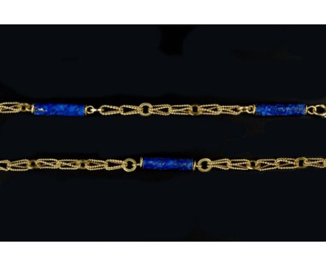 AN 18CT GOLD AND LAPIS LAZULI CHAIN BY SANNIT &amp; STEIN, comprising a line of fancy ropetwist and hoop-shaped links, spaced