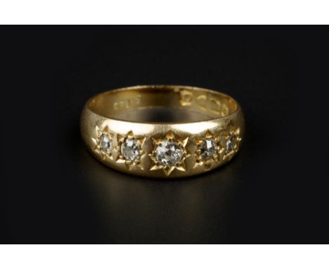 A DIAMOND FIVE STONE RING, the graduated old-cut diamonds in gypsy star settings, 18ct gold mounted, (hallmarks worn), total 