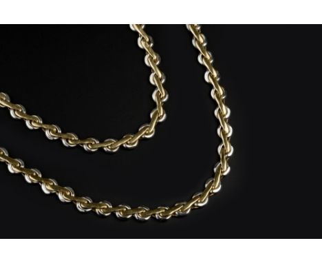 AN 18CT TWO COLOUR GOLD NECKLACE AND BRACELET SUITE, of fancy-link design, maker's mark FA, necklace length 43cm, bracelet le