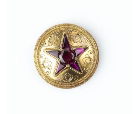 A VICTORIAN GARNET AND DIAMOND SET PANEL BROOCH, the circular panel centred with a star-shaped cluster of circular mixed-cut 
