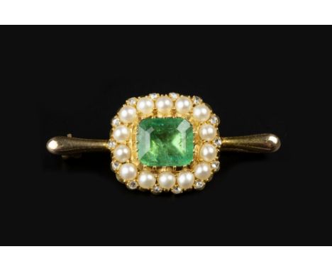 AN EMERALD, HALF PEARL AND DIAMOND CLUSTER BROOCH, the rectangular step-cut emerald with canted corners, in closed foil-backe