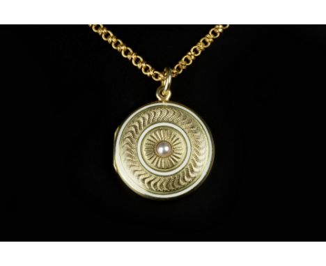 A HALF PEARL AND ENAMEL LOCKET PENDANT, the circular locket with central half pearl, to an engine-turned ground with white en
