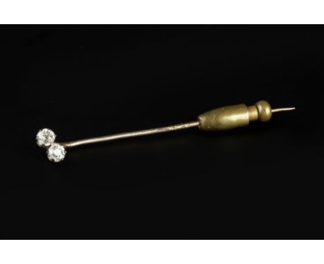 A DIAMOND TWO STONE STICK PIN, the old-cut diamonds in obliquely positioned claw settings, total diamond weight approximately