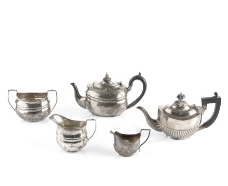 A SILVER THREE PIECE TEA SERVICE, the teapot with ebonised handle and knop, by Nathan &amp; Hayes, Chester 1911 and 1912, tea