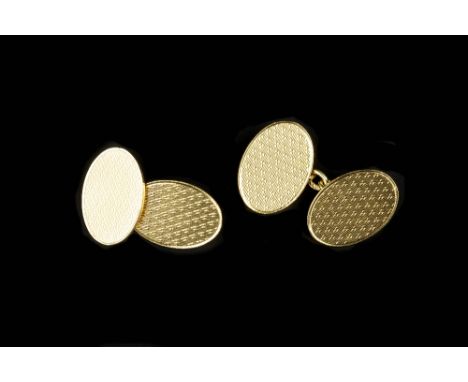 A PAIR OF 18CT GOLD CUFFLINKS, the oval panels with engine-turned decoration and chain-link fittings, together with a pair of