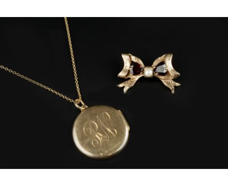 A GARNET AND CULTURED PEARL BROOCH, modelled as a ribbon bow, 9ct gold mounted, and a 9ct gold circular locket pendant, with 