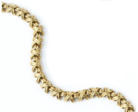 AN 18CT GOLD 'SIGNATURE X' BRACELET BY TIFFANY &amp; CO, designed as a line of repeating X-shaped links, signed T &amp; Co, w