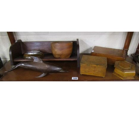 Shelf of treen etc to include mahogany study of dolphin