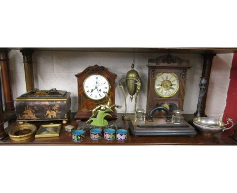 Good shelf of collectables to include desk tidy with inkwells, 2 mantle clocks, Oriental lidded box, Cloisonné etc