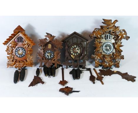 Black Forest cuckoo clocks, comprising of two quartz and two manual wind movements, for spares or repair. (4) 
