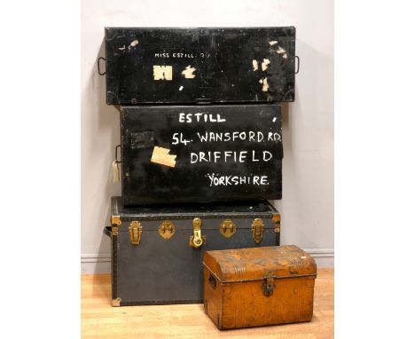 Two early 20th century metal deed boxes, together with a brass bound traveling trunk, and a smaller painted metal example. (4