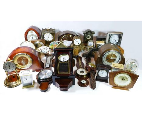 A collection of mid 20th century and later mantel clocks, wall clocks and barometers, having manual &amp; quartz movements. (