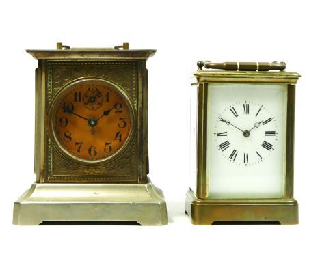 An early 20th century French brass carriage clock by E.M & Co, 8 day movement, 14cm tall, together with a German desk  clock,