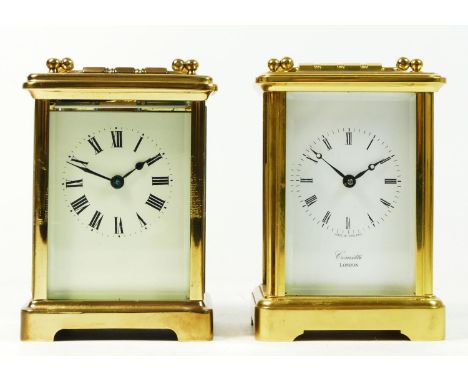 An English 8 day carriage clock, enamelled white dial, marked Comitti London, jewelled movement, 12cm tall, together with a u